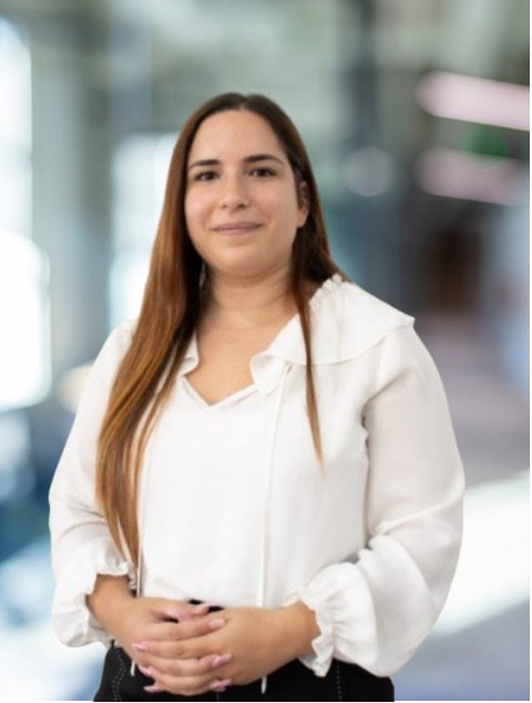 Helena Santos smiling in an office setting